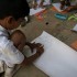 A child participating in representing an emotional-spatial map of the neighbourhood. Image courtesy of Katte Project co-organised by Maraa, a media collective and Salon Emmer, a dance collective