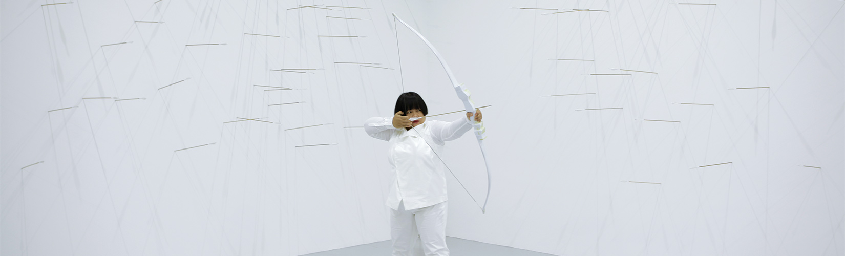Image in white of woman with bow and arrow