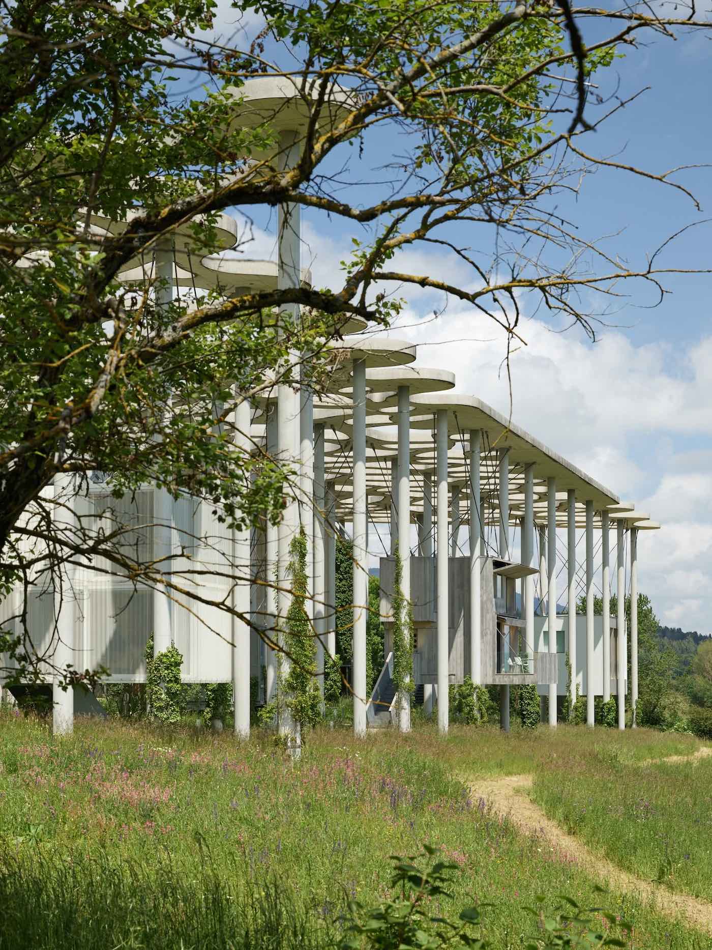 View of building pods in grassland.