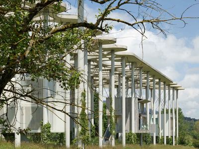 View of building pods in grassland.